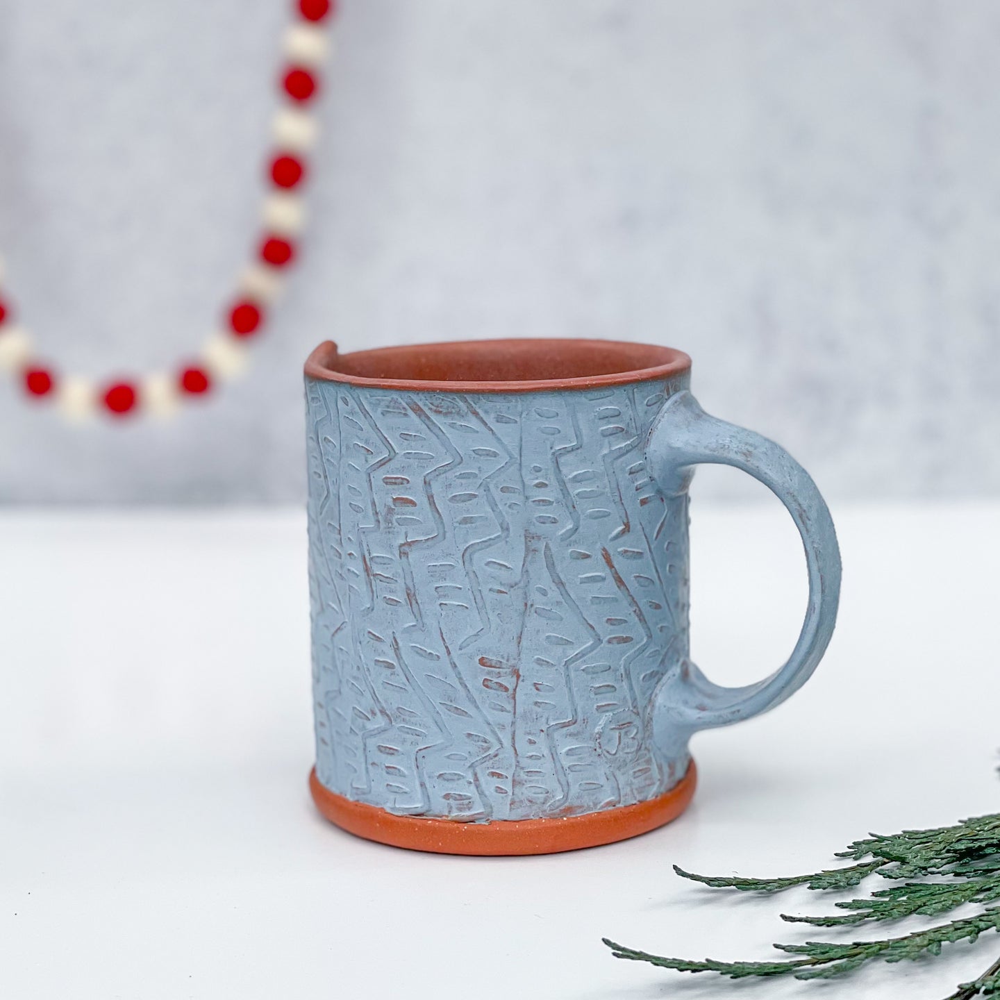 Mug with stamped pattern