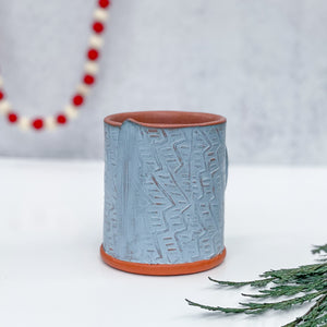 Mug with stamped pattern