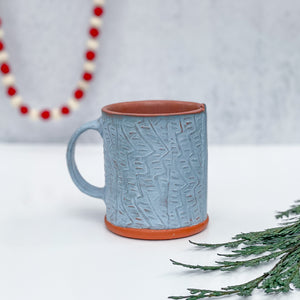 Mug with stamped pattern