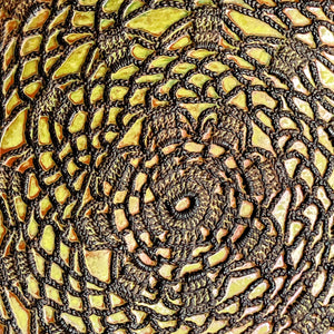 Platter embossed with spirograph design