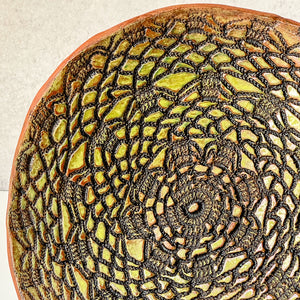 Platter embossed with spirograph design