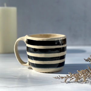 Mug with black and white stripes