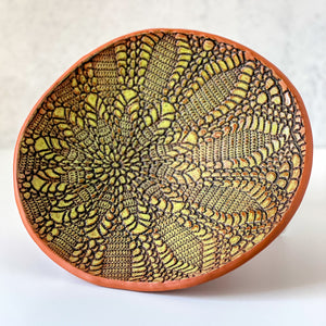 Platter embossed with sunburst design