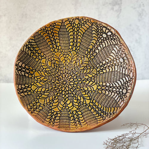 Platter embossed with sunburst design