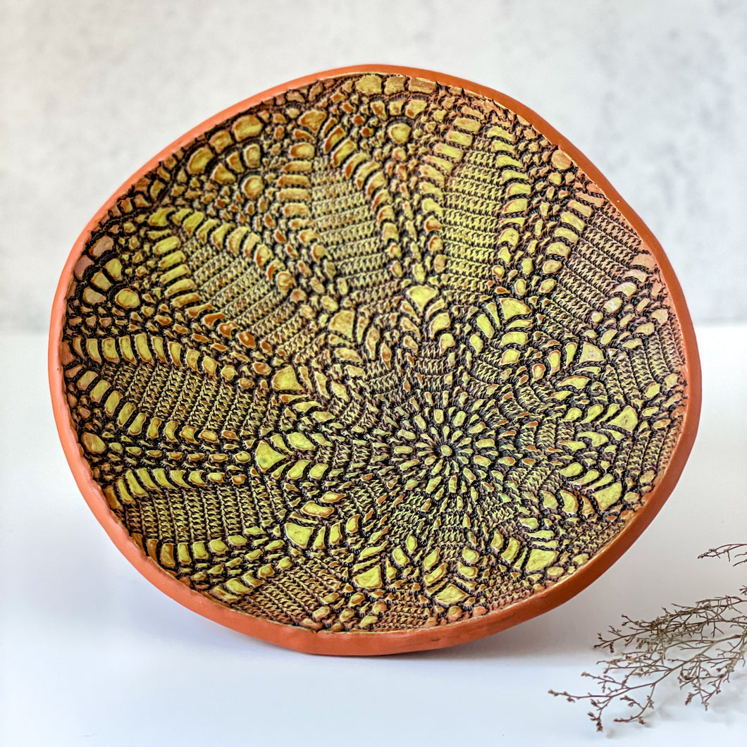 Platter embossed with sunburst design