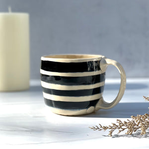 Mug with black and white stripes